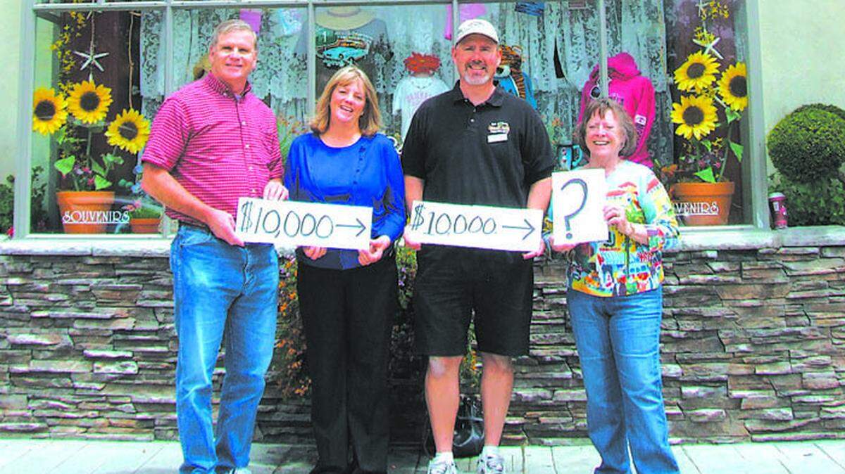 The Cambria Community Council — represented by Vice President Denis de Clercq, at left, and board Secretary Suzanne Kennedy, second from the left — has given a rare $10,000 midyear grant to match a $10,000 new-library-fund challenge grant made in March by the Old Cambria Market Place (partner Eric Johnson, is second from the right; partner John Hallvik couldn’t attend). Jeri Farrell, president of Friends of the Cambria Library, at right, now hopes another organization, business or individual will match the council's donation.