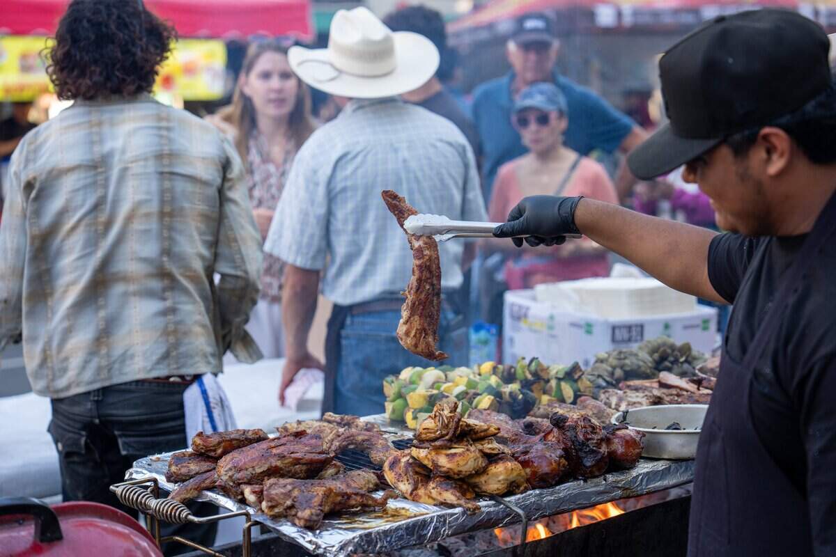 Tri-tip, chicken drumsticks, artichokes and vegetable kebabs are seasoned and grilled at Vix Creek Saloon’s booth at the Downtown SLO Farmers Market on June 25, 2025. Victor Albarran, a former F. McLintocks employee, opened his restaurant in the former McLintocks location in Arroyo Grande and now occupies McLintocks former space at the market.