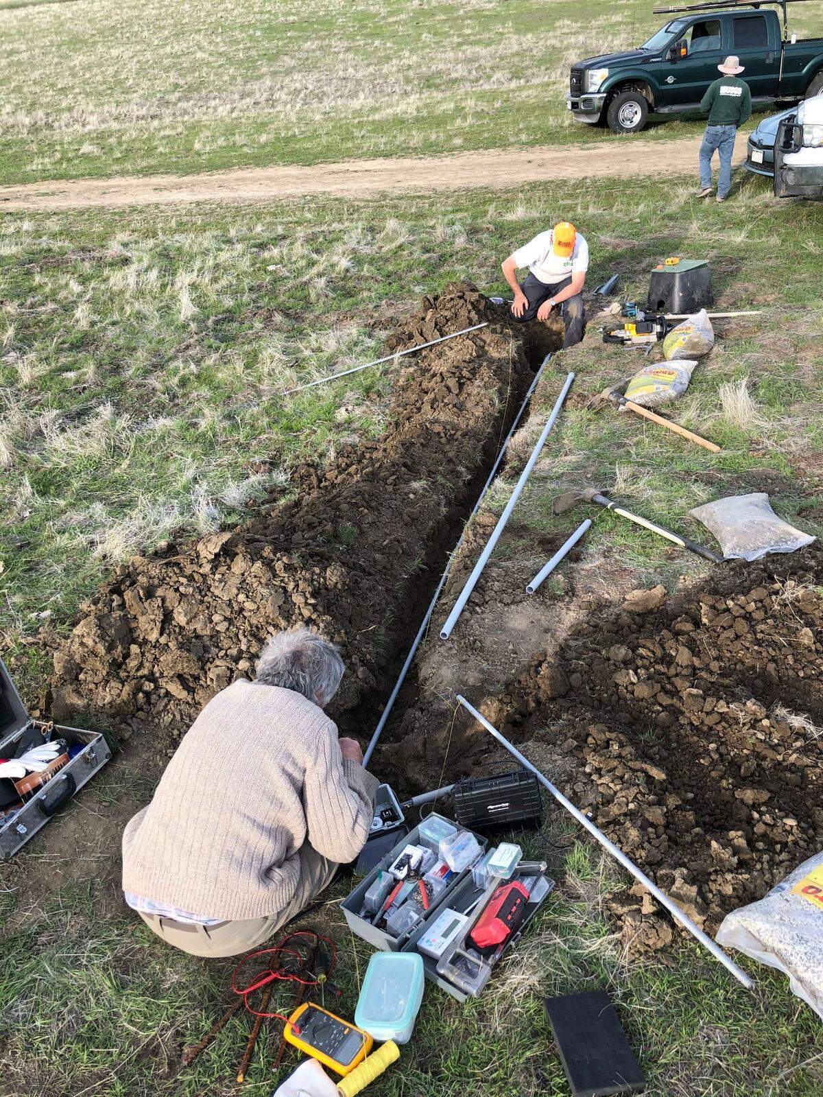 USGS scientists install an instrument that will measure continuous movement along the San Andreas Fault.