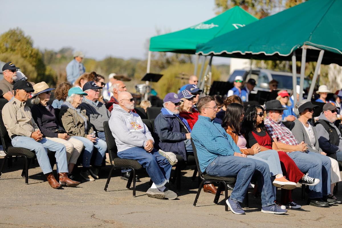 Veterans, family and friends listen to SLO County District Attorney Dan Dow speak at the Veterans Day celebration held at Los Osos Valley Memorial Park, Friday, Nov. 11, 2022.