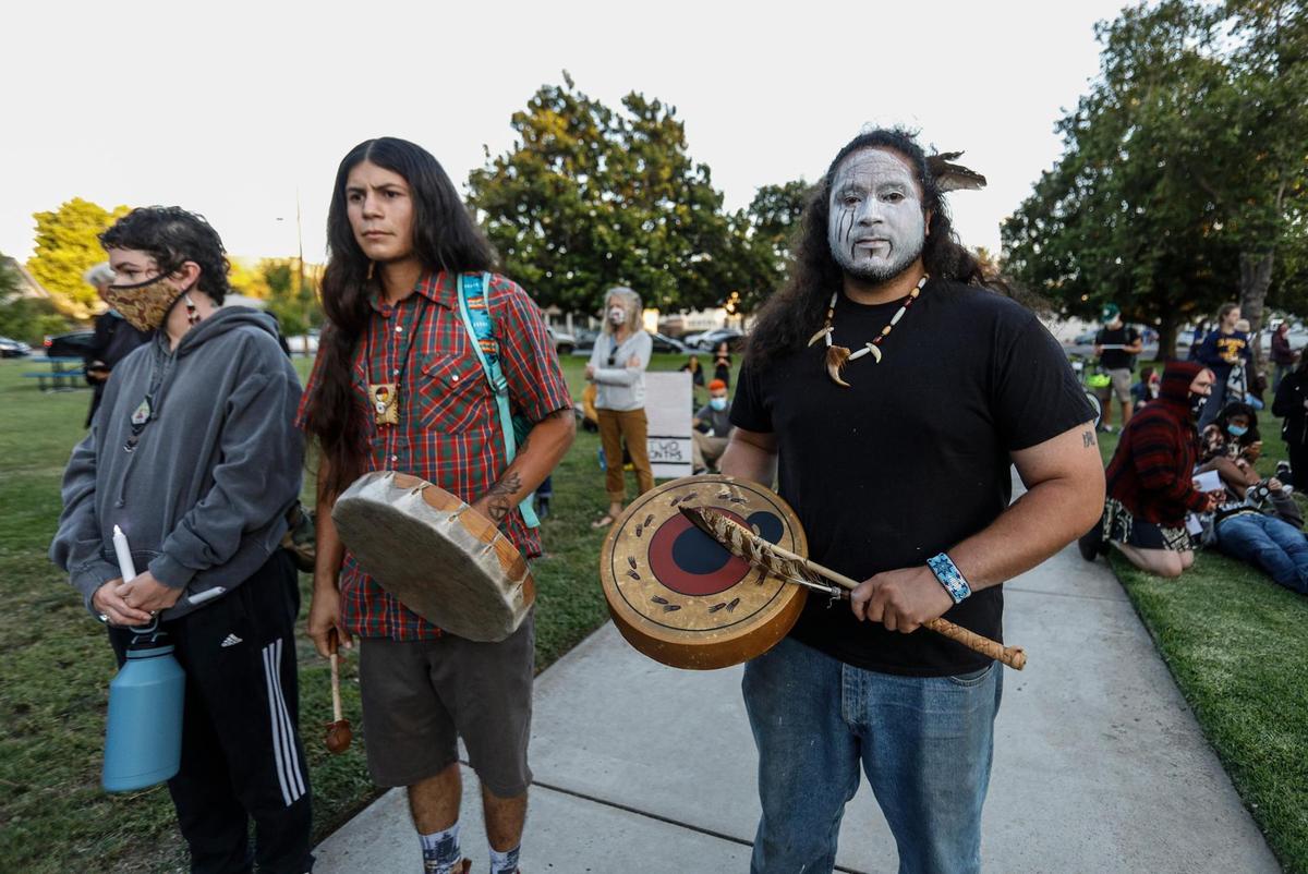 Native American Indians attend a candlelight vigil in Mitchell Park in San Luis Obispo on Thursday, June 25, 2020.