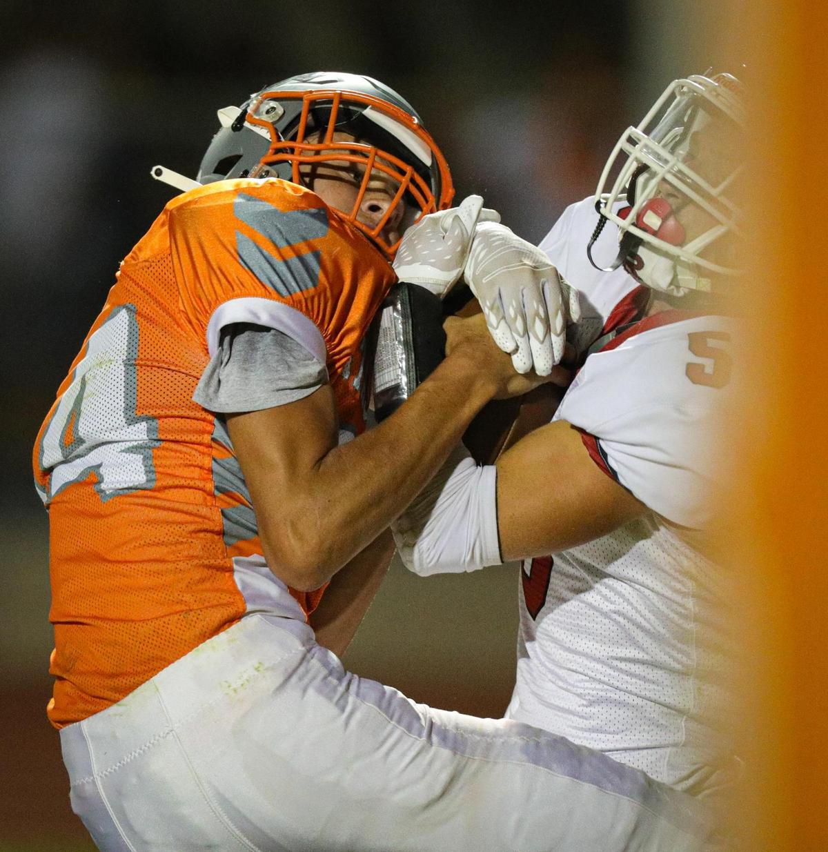Mason Degnan of Atascadero was ruled to have caught the ball for a touchdown though Trevor Lambeth tried to take it away. In the annual rivalry game, Paso Robles beat Atascadero 35-21 on Sept. 2, 2022.