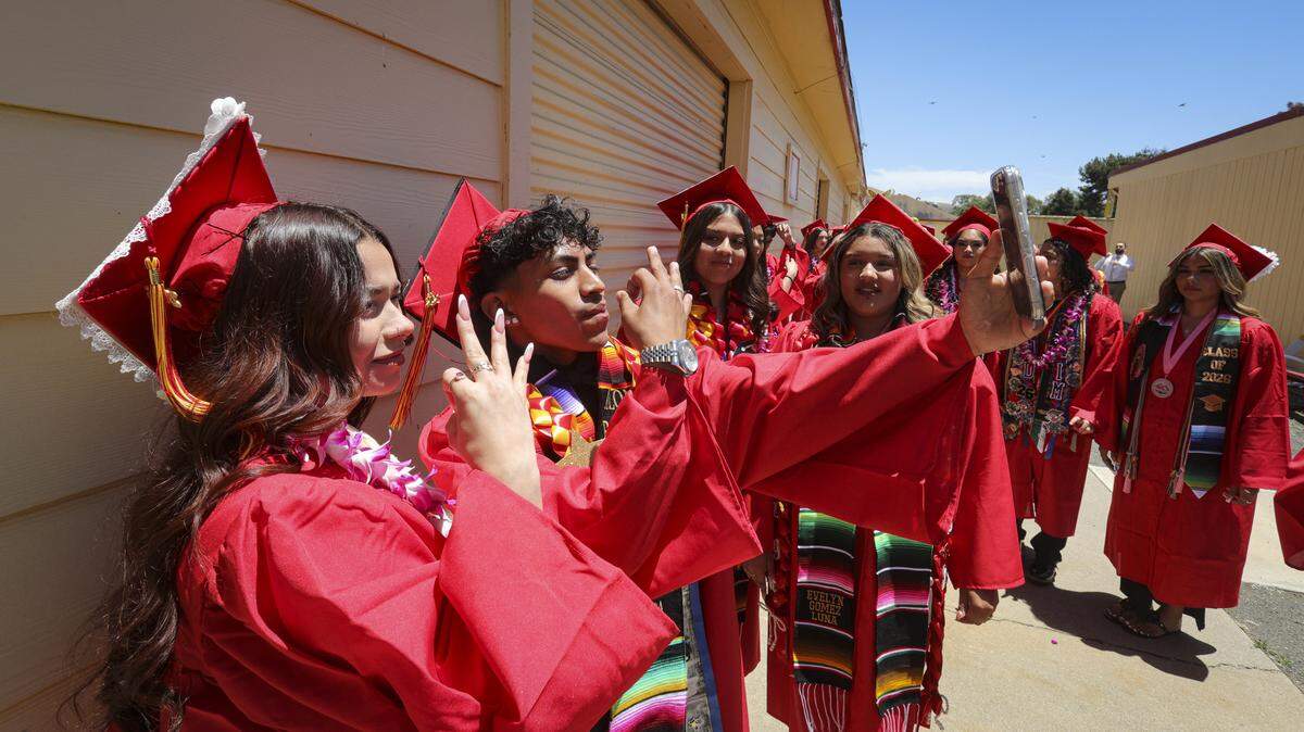 Alexa Macias and Alonso Carbajal pose for the start of a TikTok video with their classmates. Coast Union's class of 2026 included 34 graduates on June 3, 2026.