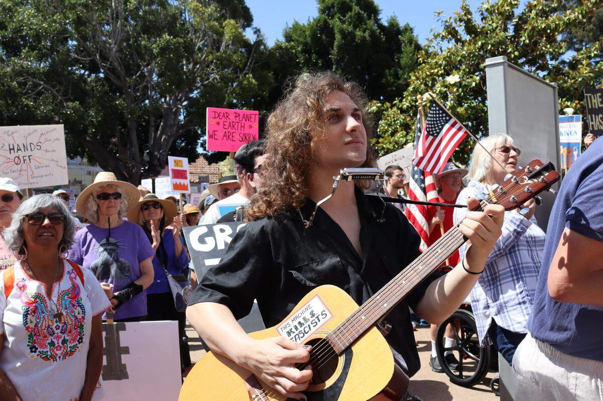 Thousands gathered in San Luis Obispo, California, for No Kings Day to protest executive overreach by the Trump administration on the President’s birthday.