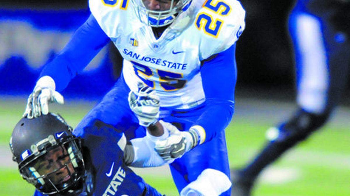 San Jose State safety Akeem King (25) breaks up a pass intended for Utah State wide receiver JoJo Natson (9) during a Nov. 21, 2014, Mountain West Conference game in Logan, Utah.