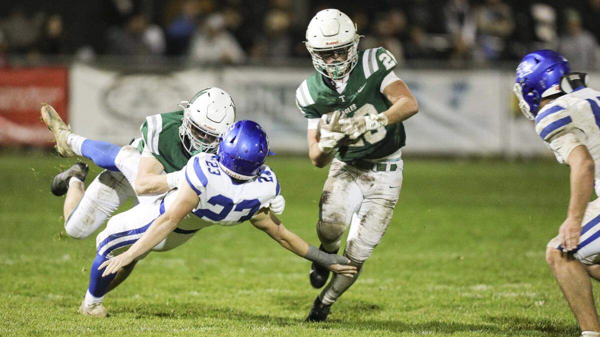 Tyler Cunningham picks up yards as Nick Capaci blocks Rocco Degraw to the ground. Immanuel beat Templeton 48-7 in the CIF Central Section Div. iV Championship on Nov. 21, 2025.