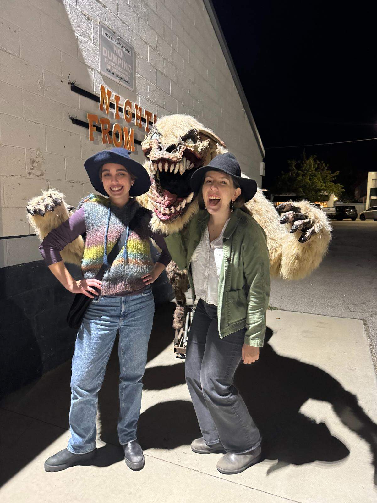 From left, Tribune reporters Stephanie Zappelli and Hannah Poukish pose for a photo outside of Nightmare from Main Street, a 6,000-square-foot haunted house in Paso Robles.