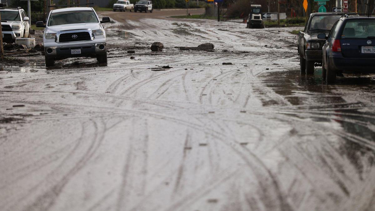 Mud fills Main Street in Morro Bay near Highway 1 on Tuesday, Jan. 10, 2023, after creeks overflowed the banks.