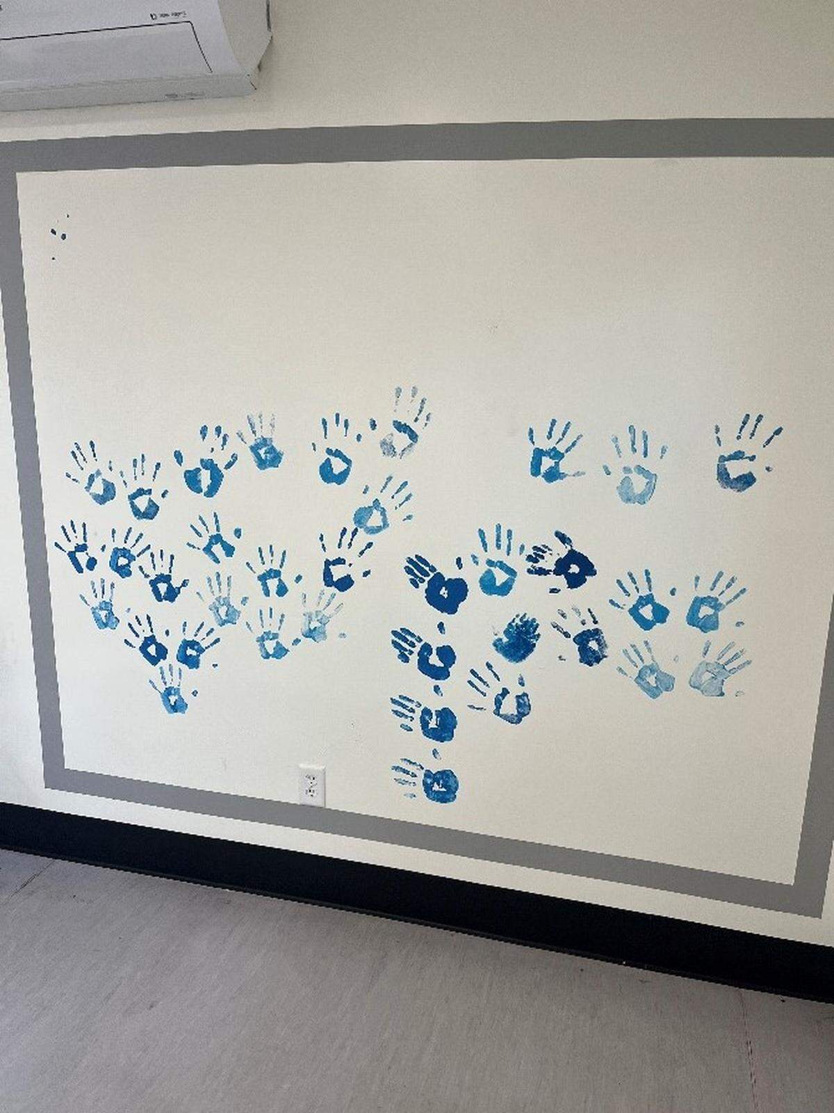 A new mural was commissioned at both El Camino Homeless Shelter campuses in Atascadero and Paso Robles, made of hand prints of successfully housed 90-day residential shelter program graduates.