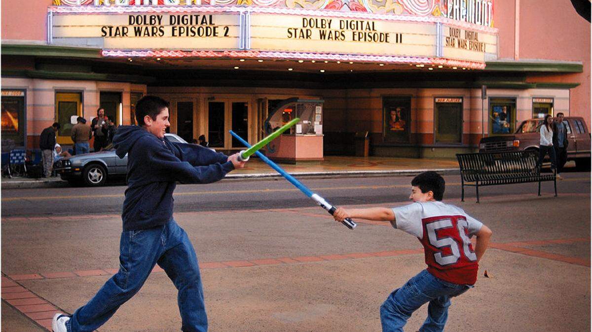 Steve Jones, 17, and Michael Anaya, 11, duel with their lightsabers before a sold-out midnight show of "Star Wars: Episode 2" at the Fremont Theater in San Luis Obispo in May 2002.