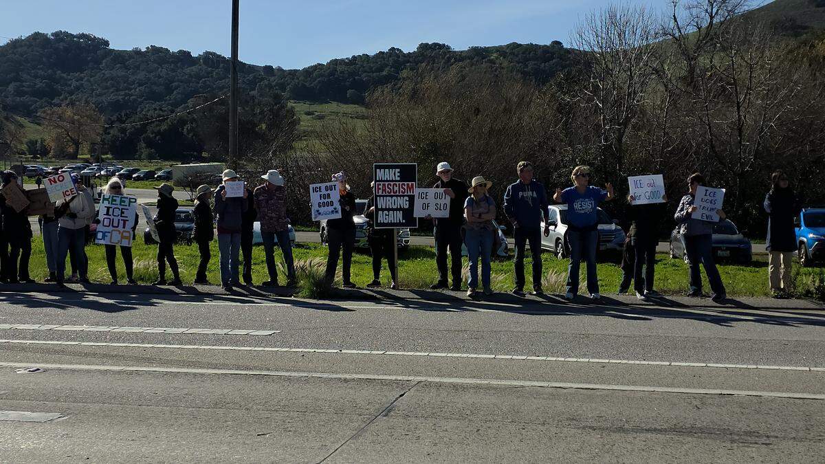 More than 250 people gathered at Highway 1 and Kansas Avenue to protest ICE in San Luis Obispo on Jan. 11, 2026.