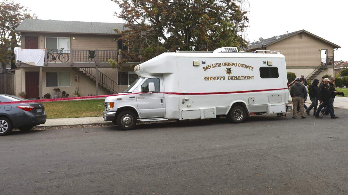 Investigators continue to work Tuesday morning at the scene of a shooting that took the life of a San Luis Obispo police officer, the suspect also died. A warrant was served at the apartment at the upper left on Monday evening where the shooting took place.