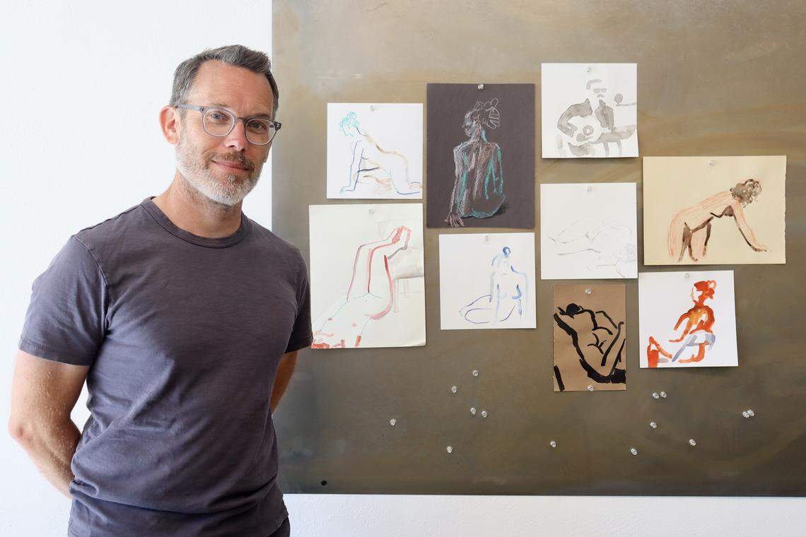 Artist Arthur Mount, co-owner of Fieldwork in Atascadero, stands next to figure drawings he created during studio workshops offered in the space. Fieldwork moved to its downtown location at 5880 Entrada Avenue in March 2026.