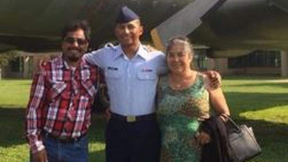 U.S. Air Force Staff Sgt. Caesar Flores, center, with his father, Andres Flores, and mother Juana Flores, who was deported to Mexico in 2018 after spending 30 years in the U.S.