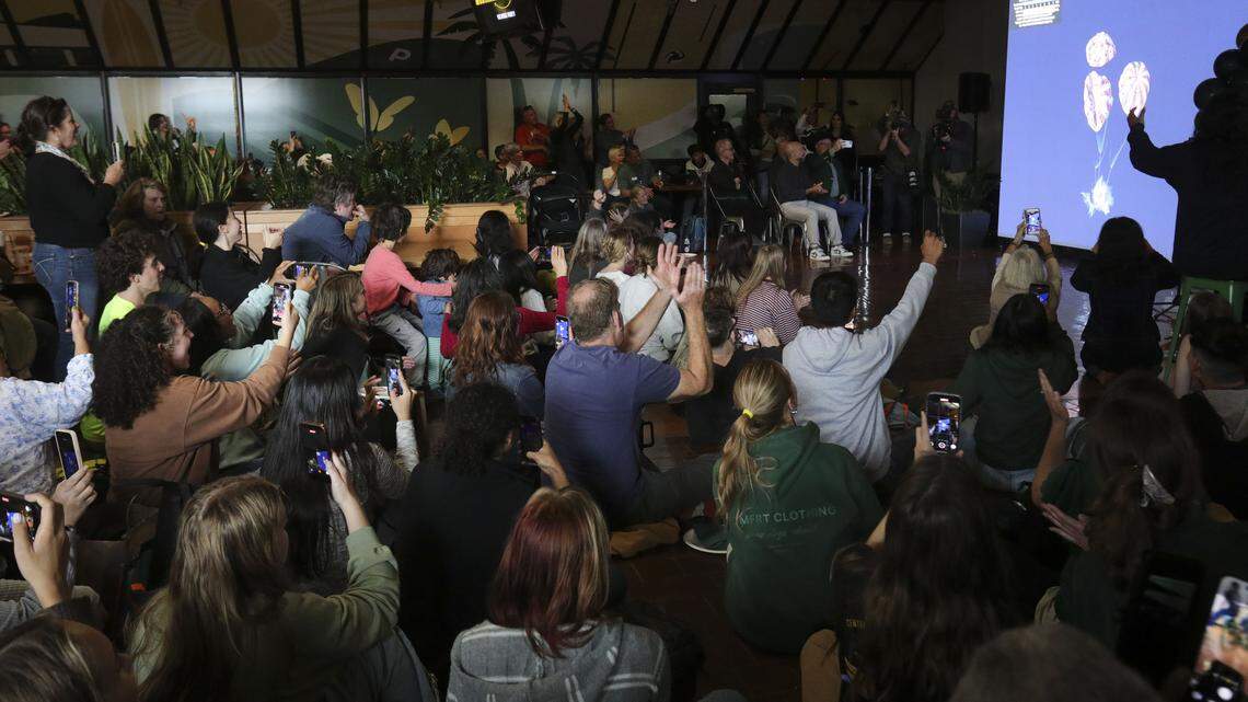 An audience of about 300 cheers the splashown of the Artimis II mission around the moon April 10, 2026 at Cal Poly's University Union.