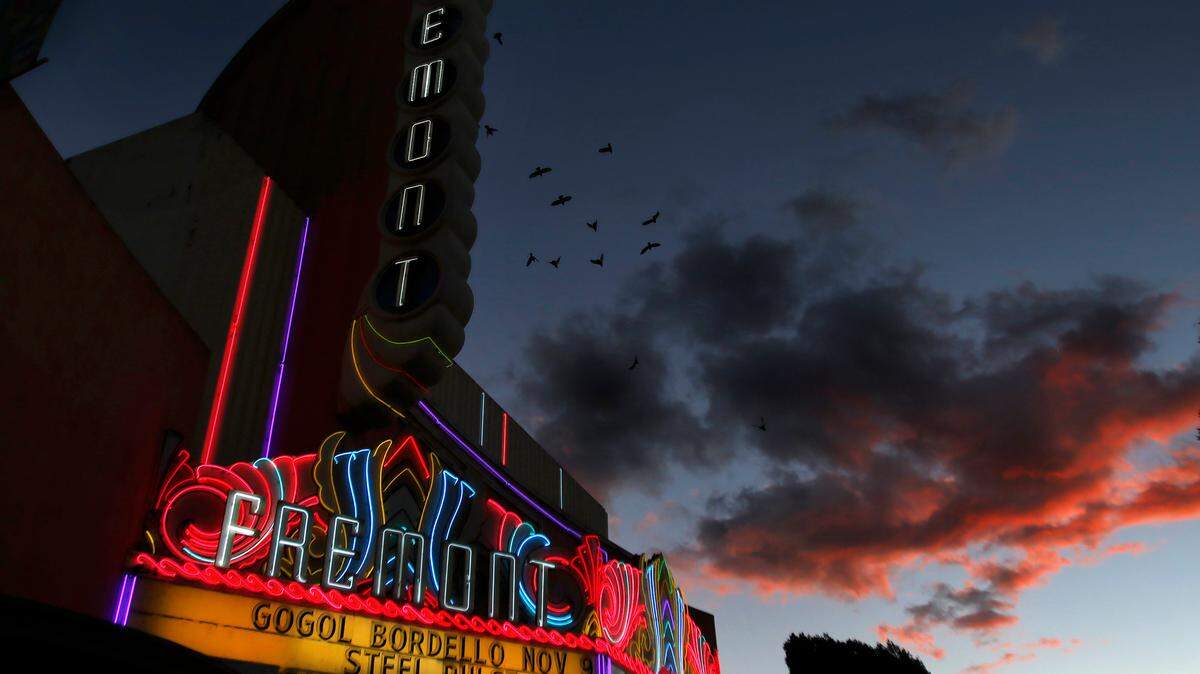 A former employee is suing the Fremont Theater operators for allegedly firing him after he reported sexual misconduct.