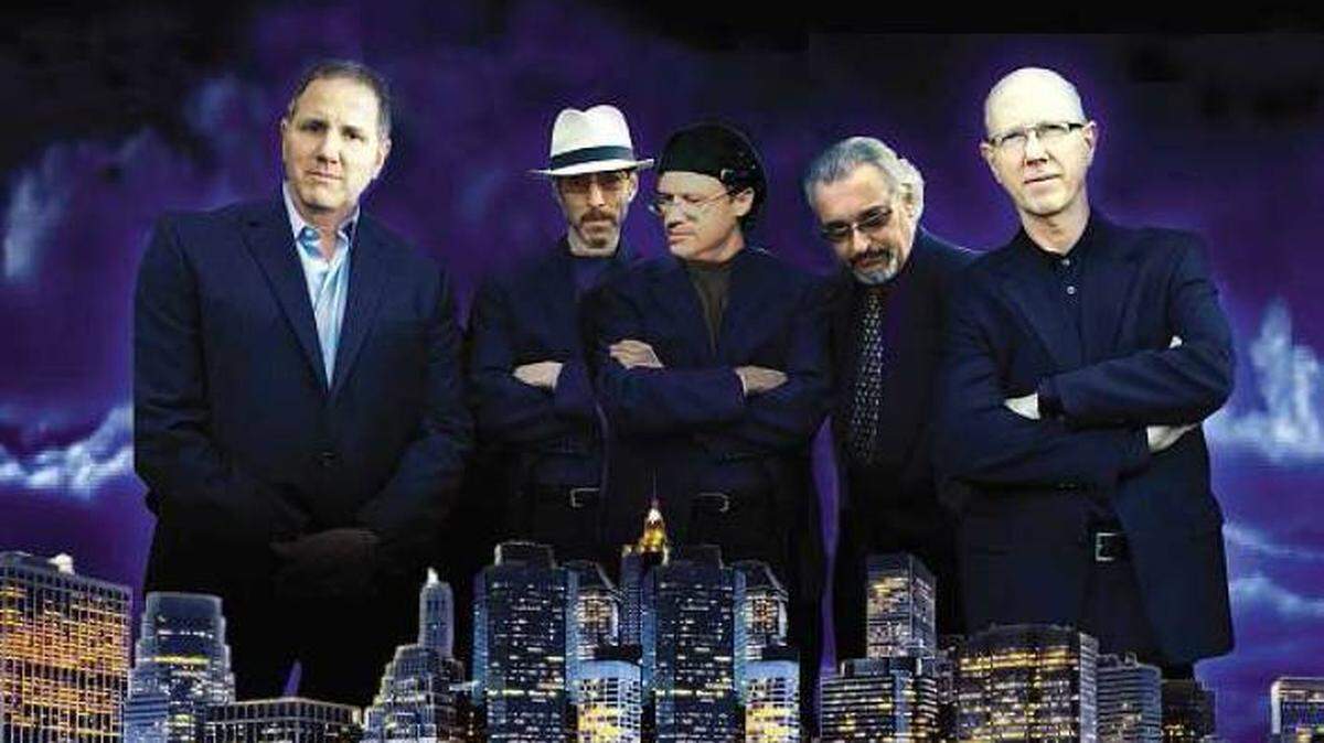 The Hit Men include keyboardist and group founder Lee Shapiro, lead guitarist/vocalist Jimmy Ryan, bassist/vocalist Larry Gates, vocalist Russ Velasquez and drummer Gerry Polci.