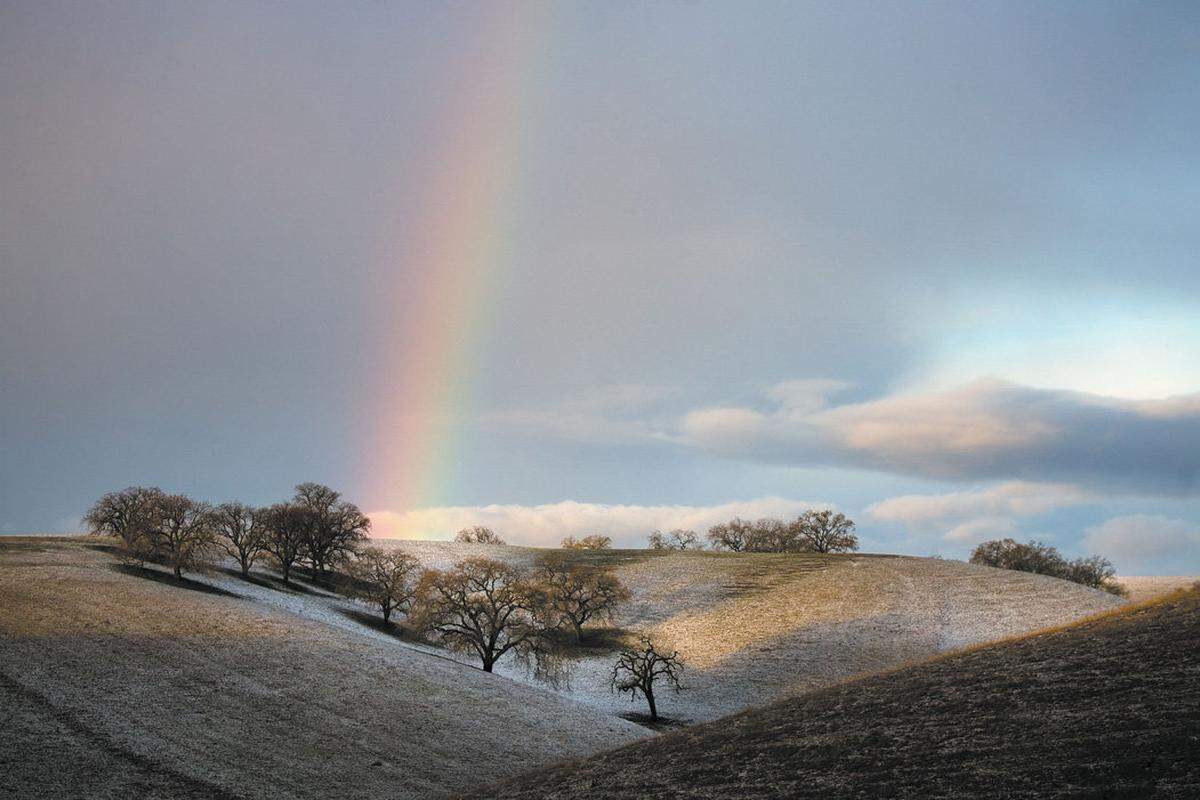Jan. 24, 2008: A light sprinkle of snow is the treasure at the end of this rainbow, spotted at sunrise on Highway 41 east of Creston.