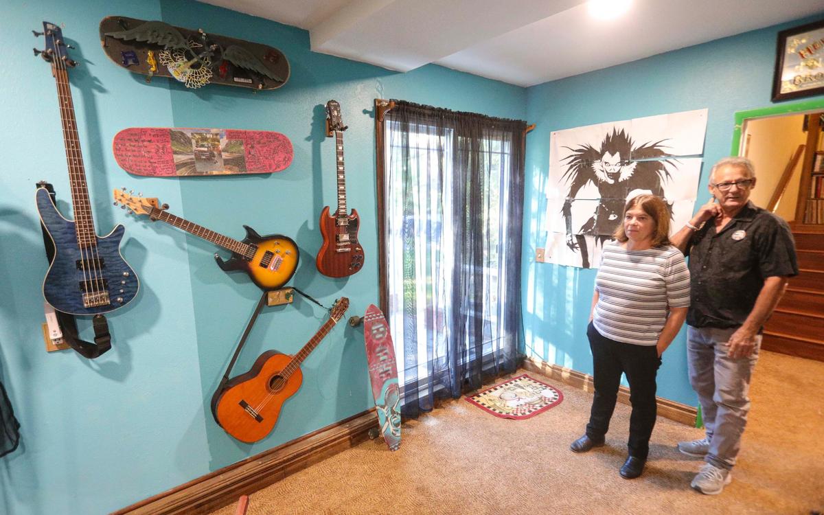 Mary Jane and Bill Jodry have unanswered questions about the death of their son Thomas, who died at the age of 21 in a fall from a San Luis Obispo parking structure five years ago. Thomas played music and created artwork on the wall, seen here at their Atascadero home on Sept. 10, 2024.