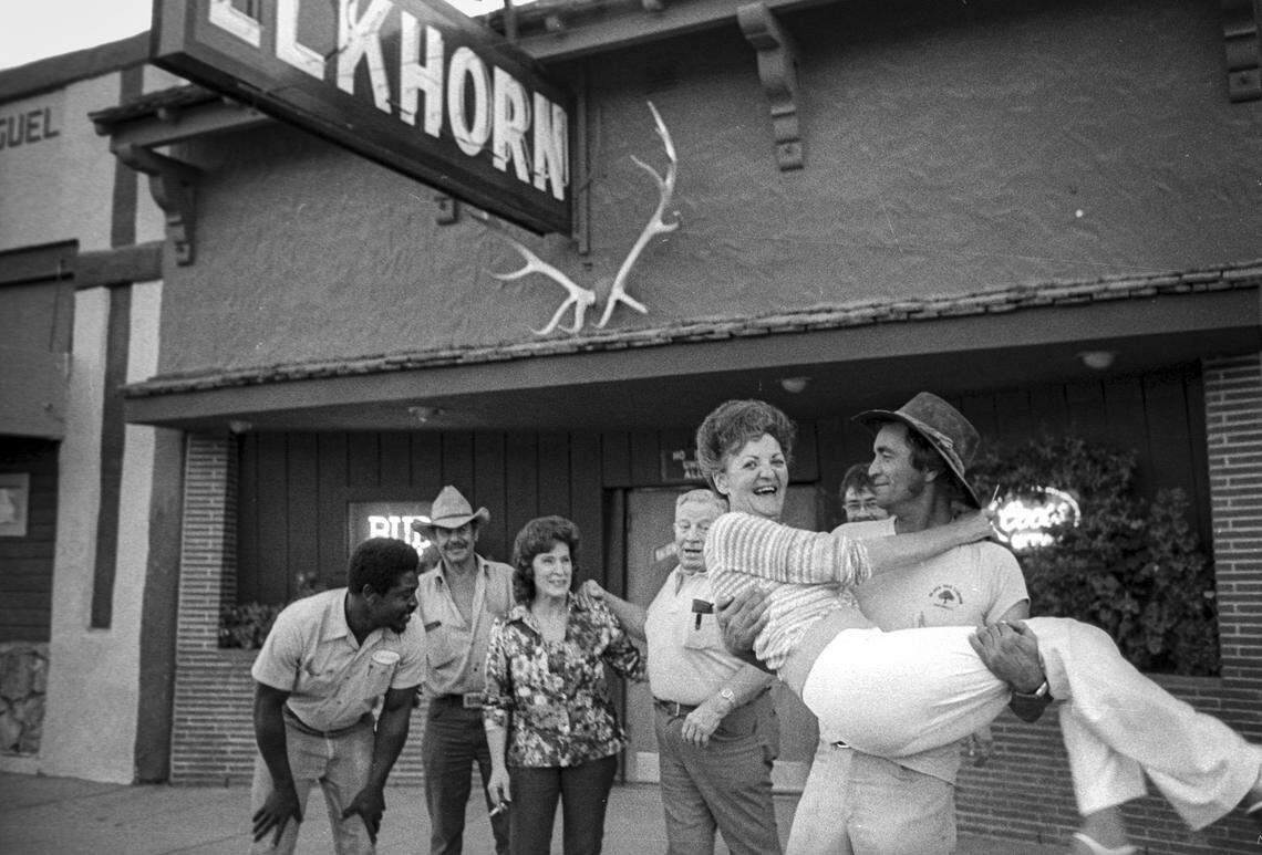 In a bit of horseplay outside San Miguel's Elkhorn bar, Dave Cantrell holds Maxine Conner, while Joe Ledbetter, left to right, Fred Vaca, bartender Pat French, bar owner Jack Stringham and Jim Sunigan look on in San Miguel on Sept. 24, 1980.