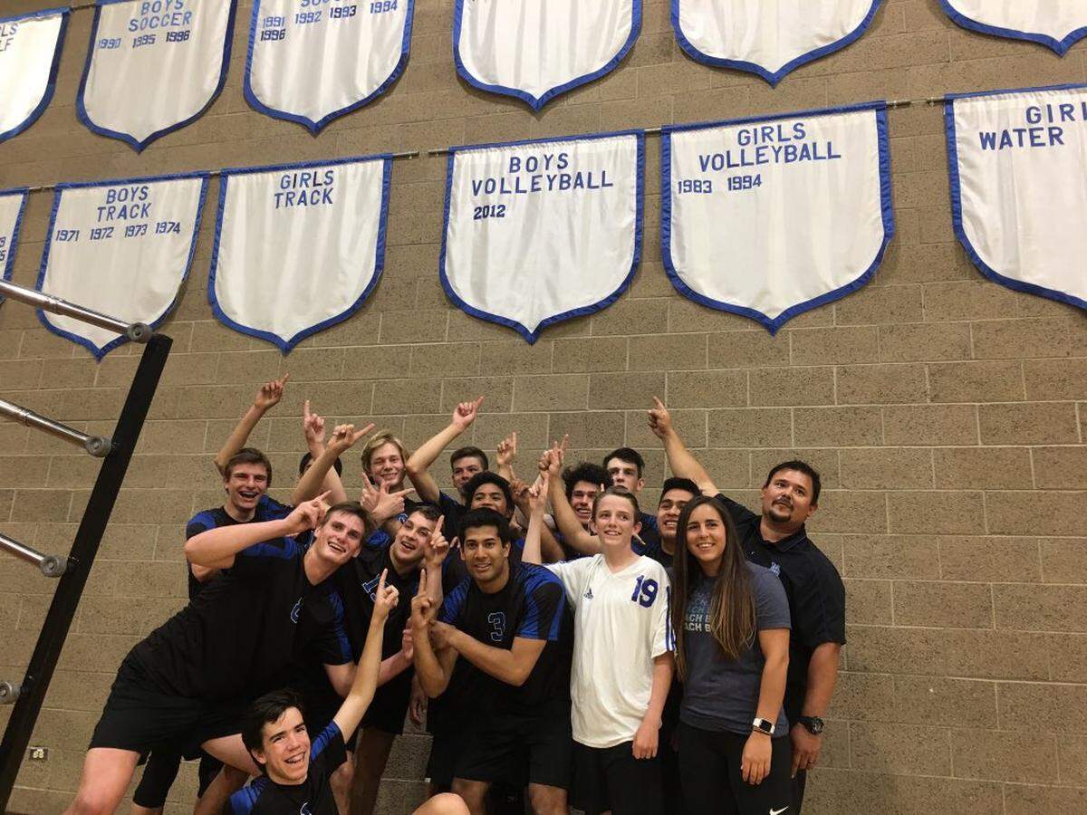 The Morro Bay High School boys volleyball team celebrates its 2018 league title, its first since 2012, after a win against Orcutt Academy. James Bueno, right, was the coach of the team.