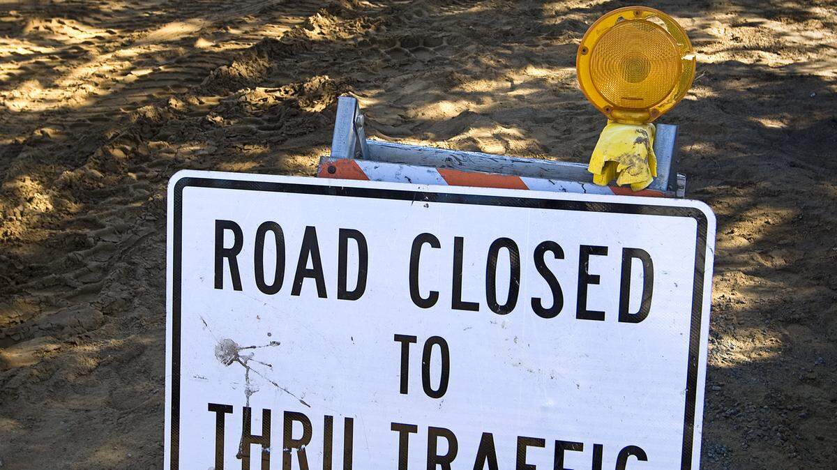 A "road closed" sign on Pismo Avenue as work on the installation of sewer lines continues in Los Osos in January.