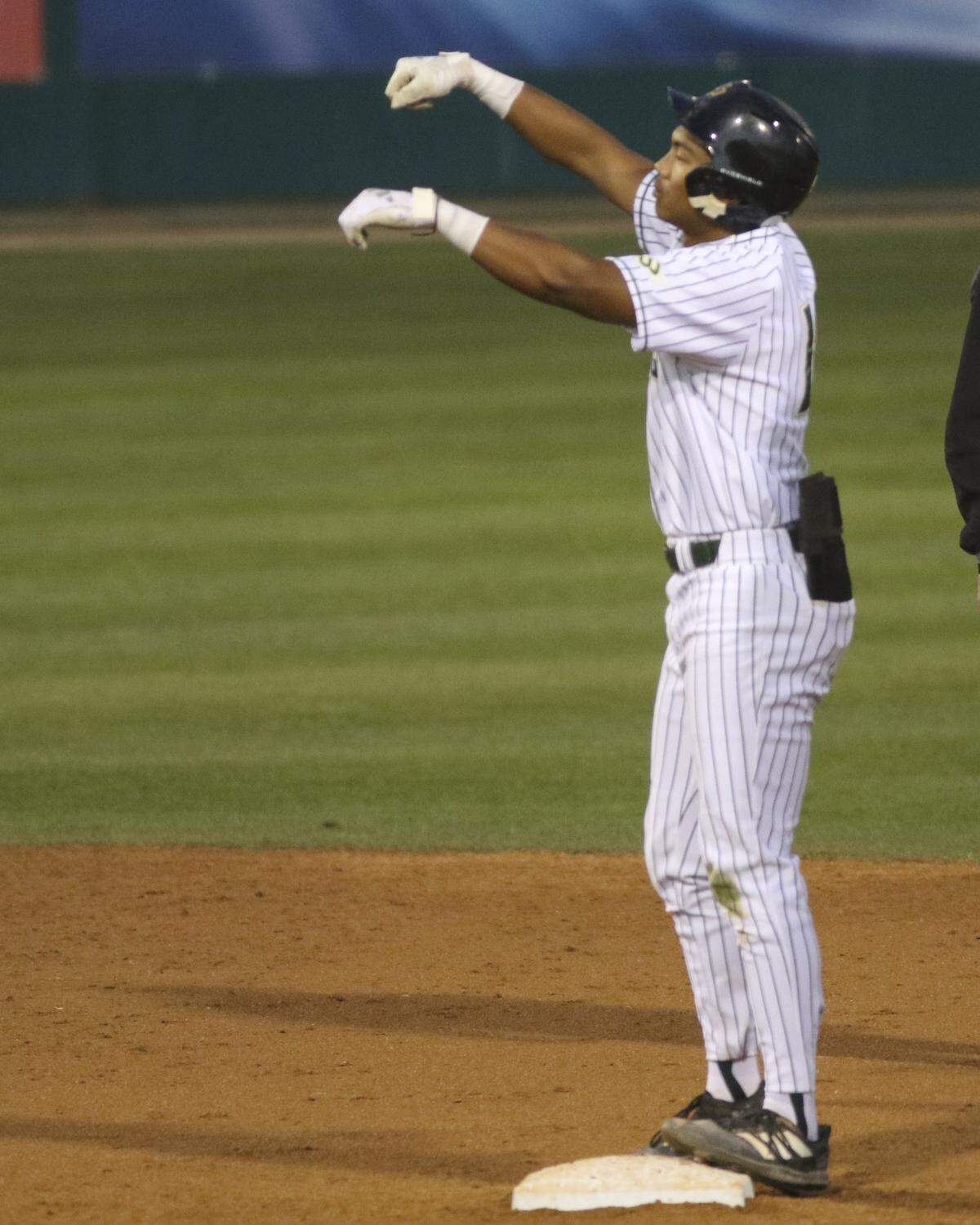 Antonio Castro signals the bench after ending up on second base. Cal Poly lost 6-0 to UCSB on April 2, 2026.