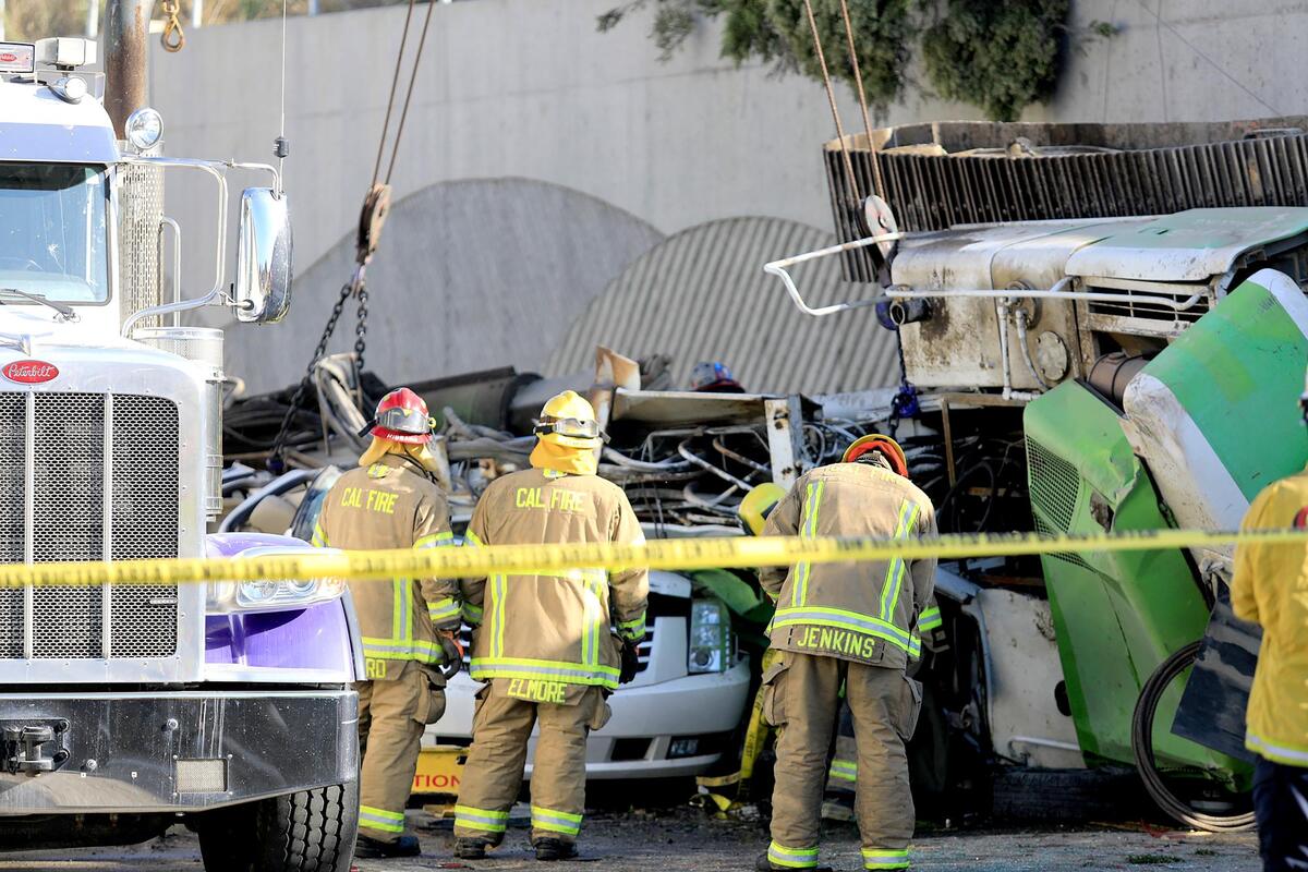 A 60-year-old Nipomo woman was killed Wednesday when an excavator fell from a truck that hit the guardrail on Highway 101 in Nipomo and fell onto a white Cadillac Escalade on the Willow Road off-ramp below.