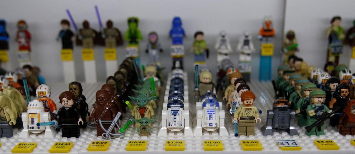 Minifigurines fill a glass case at the new Lego store named Bricks & Minifigs in San Luis Obispo, Saturday, Nov. 19. 2022.