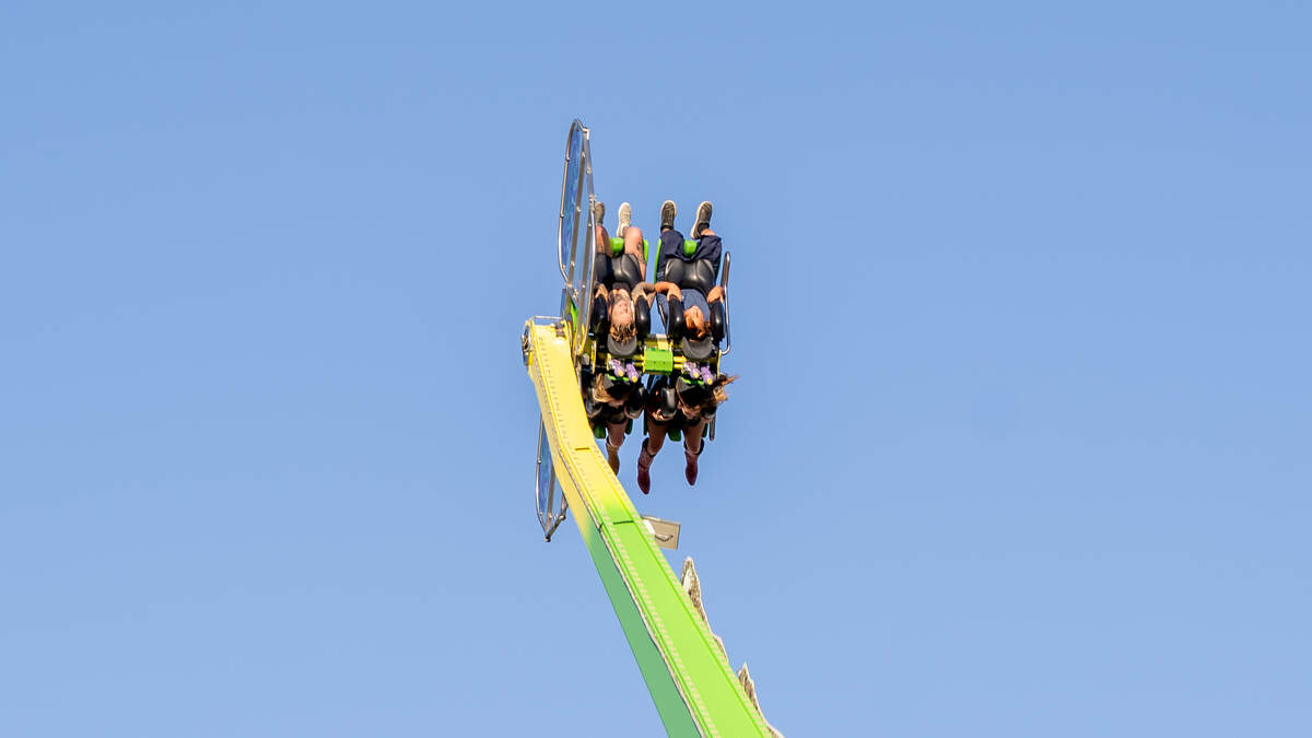 Fairgoers ride a spinning ride at the California Mid-State Fair on July 15, 2026. Temperatures soared past 100 degrees on opening day.