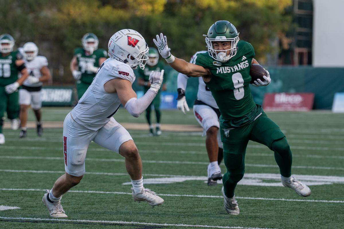 Cal Poly wide reciever Kian Salehi runs toward the goal line in the first half against Western Oregon on Saturday, Sept. 13, 2025. The Mustangs defeated the Wolves in a 56-7 rout at home.