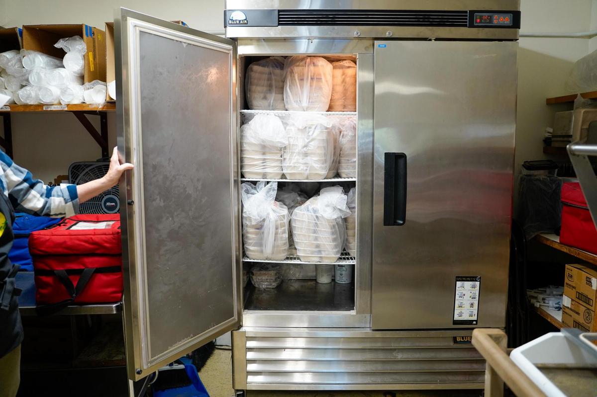 Frozen meals in bags of seven wait for delivery at Meals That Connect’s Atascadero dining site at the Atascadero Senior Center Tuesday, Dec. 17, 2024. Meals That Connect has served 185 Atascadero households with home delivery in 2024, an area that serves as a distribution hub for several other communities.