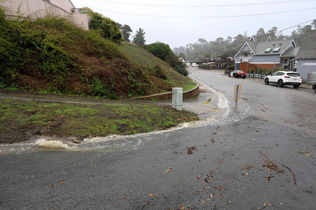 Rainwater flows onto Sheffield Lane from Hartford Street in Cambria. A strong storm hit the North Coast area with heavy rain and high winds on Wednesday, Jan. 27, 2021.