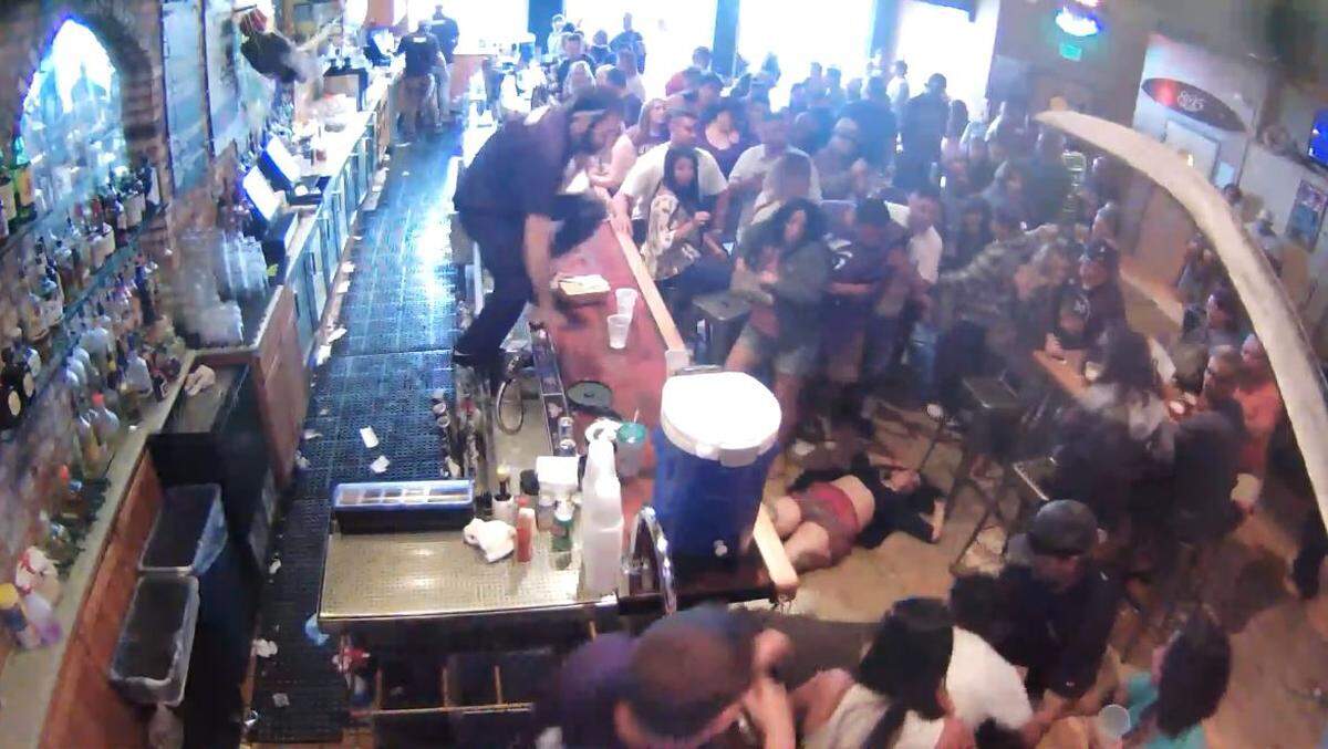 Camille Chavez lies unconscious on the ground after being knocked out by Chris Olcott on May 28, 2016, at Mr. Rick’s bar in Avila Beach. Olcott, a San Luis Obispo building inspector, has been placed on paid leave. He pleaded guilty to misdemeanor battery after a felony trial ended in a hung jury last year.