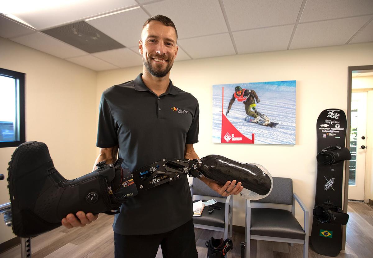 Snowboarder Andre Barbieri of Santa Barbara will compete for his native Brazil in March in the 2022 Beijing Paralympic Games. After losing his leg following a crash at Mammoth in 2011, he learned to use a prosthetic limb and returned to the slopes. Here, he shows off the high-tech prosthetic at the Hanger Clinic in San Luis Obispo.