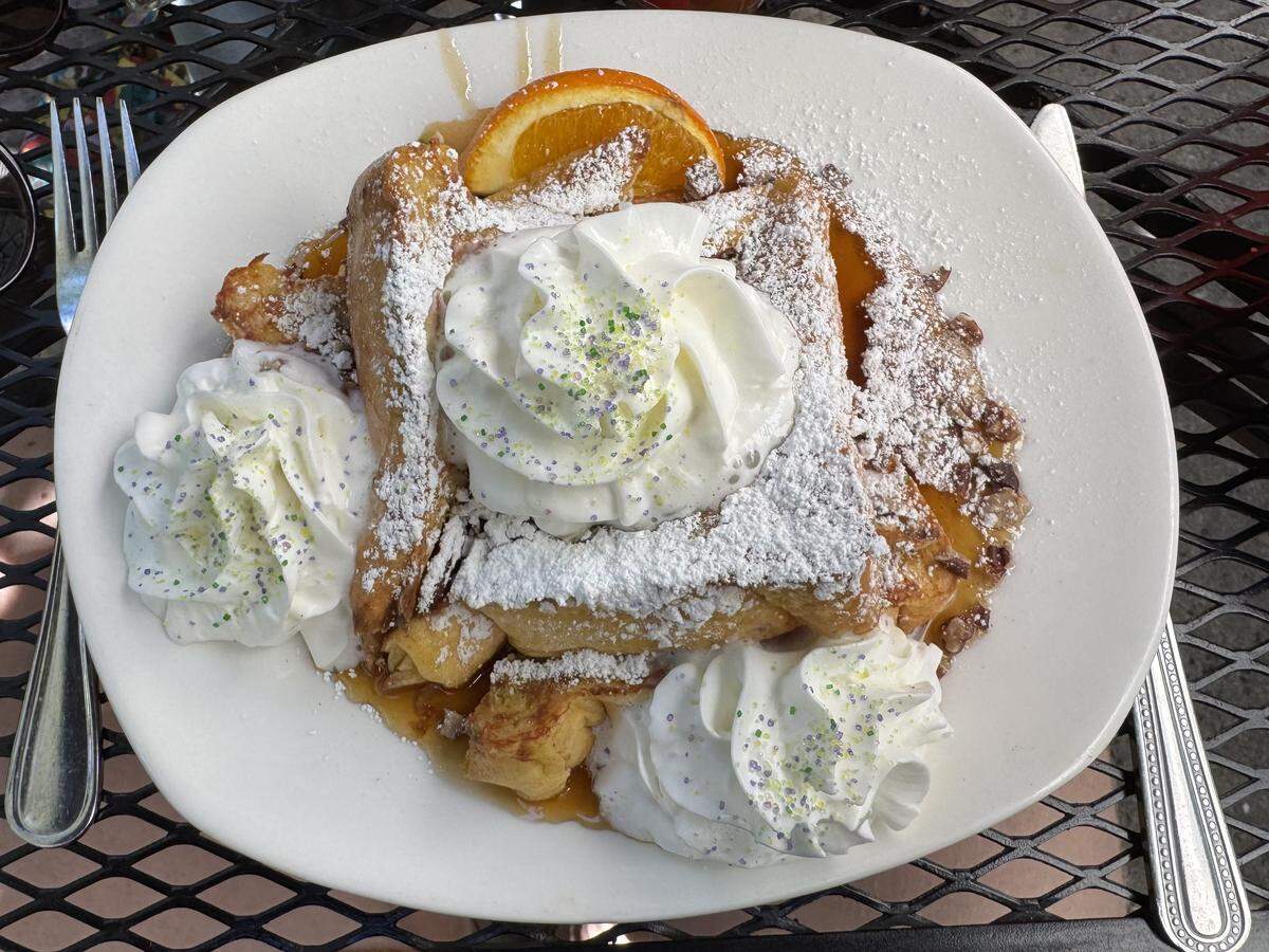 The Pain Perdu at Bon Temps Creole Cafe is a French toast with roasted pecans, whipped cream and sprinkles. It’s served with a syrup made from honey, rum and spices. Seen here on March 14, 2026.