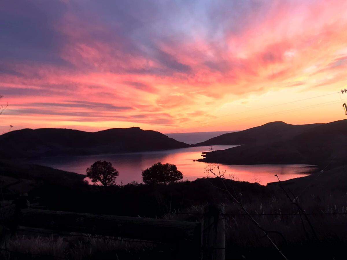 Laura Selkirk of Cayucos Cellars was on her way home on Nov. 9, 2020, when she captured this image of a vivid sunset over Whale Rock Reservoir. The vista was so dramatic that she “turned the car around and was literally leaning through the passenger side” to get the photo, Selkirk said.