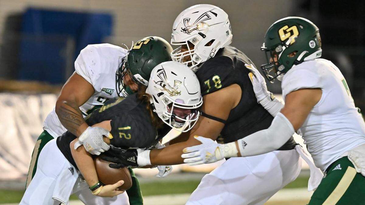 Josh Ngaluafe (99) sacks Sacramento State quarterback Jake Dunniway in the end zone for a safety, the Mustangs’ first in 11 years. Cal Poly fell to Sacramento State 41-9 on Nov. 6, 2021, at Hornet Stadium.