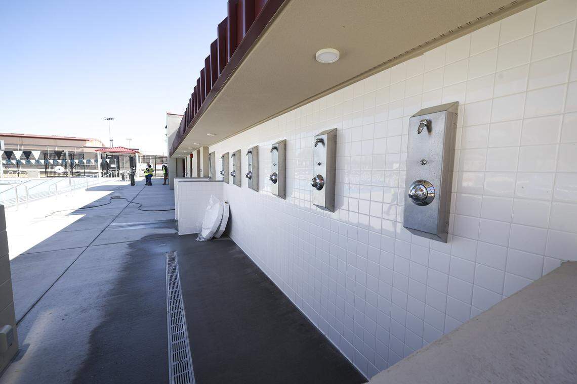 Outdoor shower stations are on the wall beside the pool. The eagerly anticipated aquatic center at Paso Robles High School was undergoing final finish work on March 5, 2026, the day before dedication.