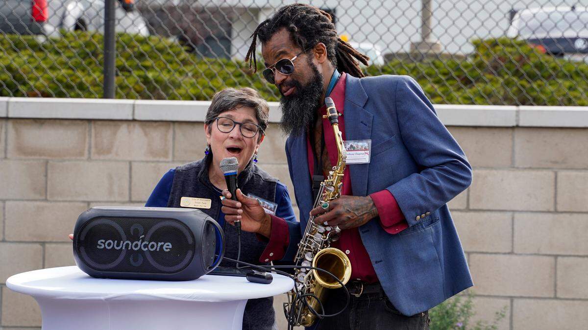 Atascadero Mayor Pro Tempore Susan Funk sings “What a Wonderful World” with Anthony Chapman, a resident of the newly-opened Broad Street Place affordable housing project, Jan. 30, 2024.
