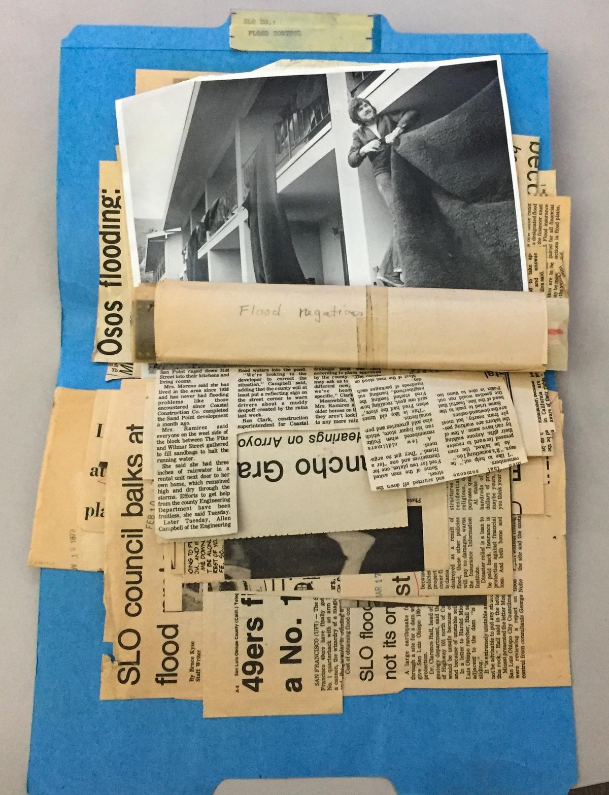 The 1973 San Luis Obispo flood negatives turned up in an unlikely folder, under clippings wrapped in paper and tape, seen here at the center of the frame.