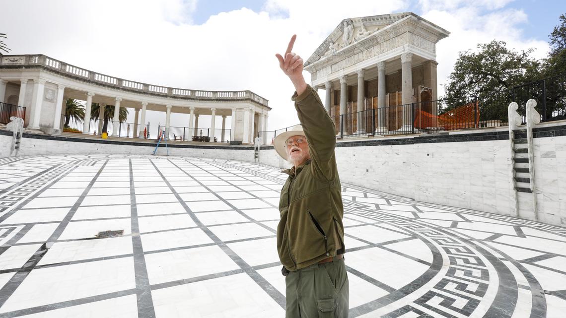During a May tour, State Parks’ Harold Hadley points out statuary that needs to be returned after tile is set in place as part of renovation work on the Neptune Pool at Hearst Castle.