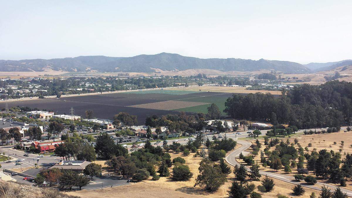 In a view from the hill adjacent to Laguna Lake Park, the former Dalidio Ranch property reaches from the edge of the SLO Promenade to Highway 101.
