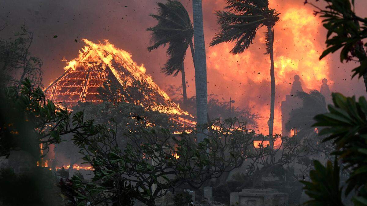 The hall of historic Waiola Church in Lahaina and nearby Lahaina Hongwanji Mission are engulfed in flames along Wainee Street on Tuesday, Aug. 8, 2023, in Lahaina, Hawaii.