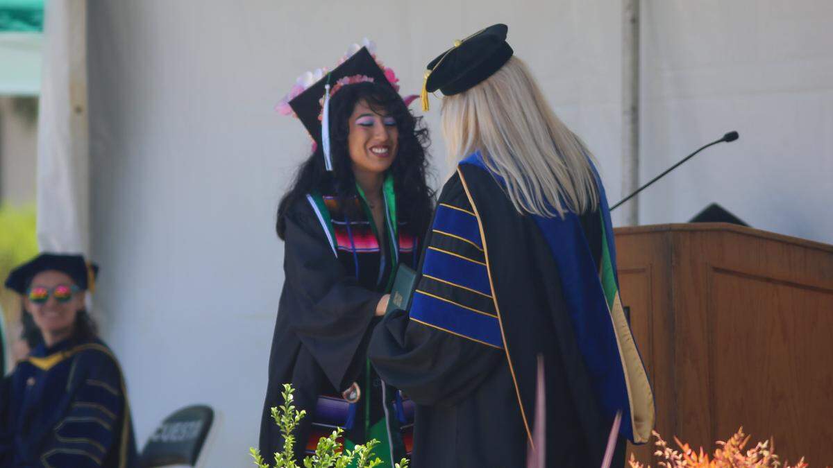 Cuesta College graduate Frida Blackwell receives her diploma from Cuesta College president Jill Stearns on Friday, May 22, 2026. More than 1,500 students walked the stage on Friday.