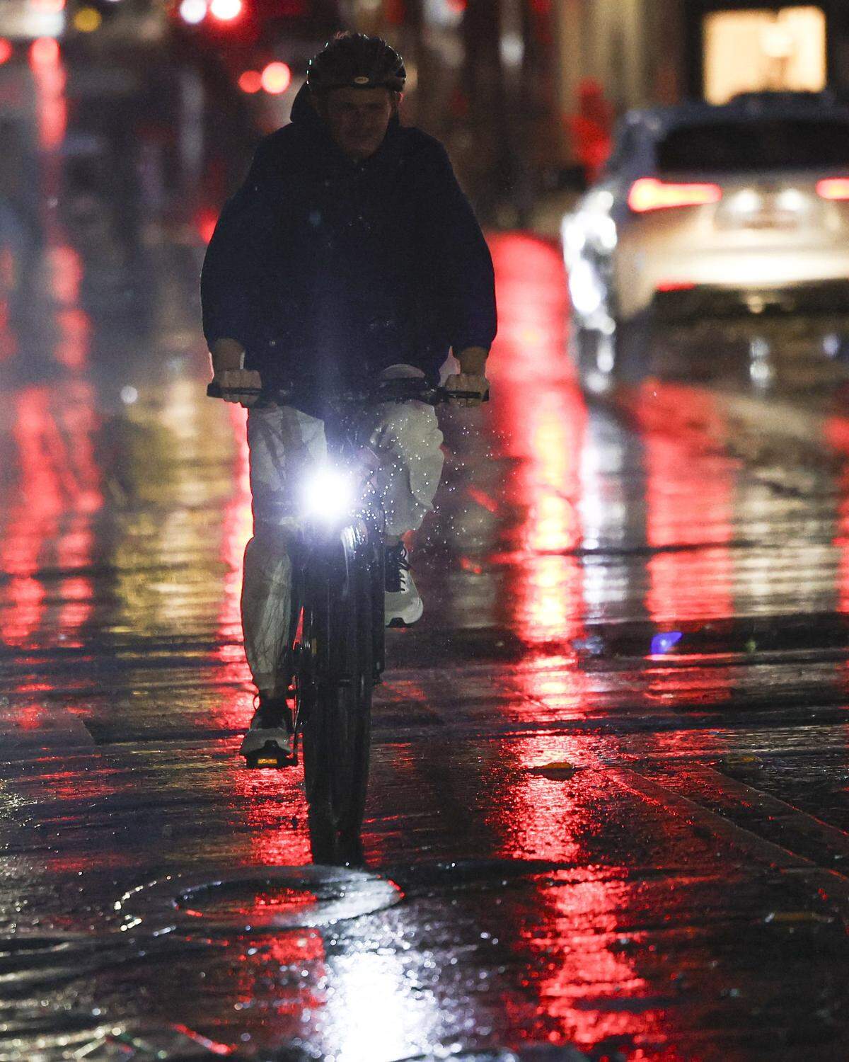 Bicyclist rides on Chorro St as rain falls in downtown San Luis Obispo on the evening of  Feb. 10, 2026. 