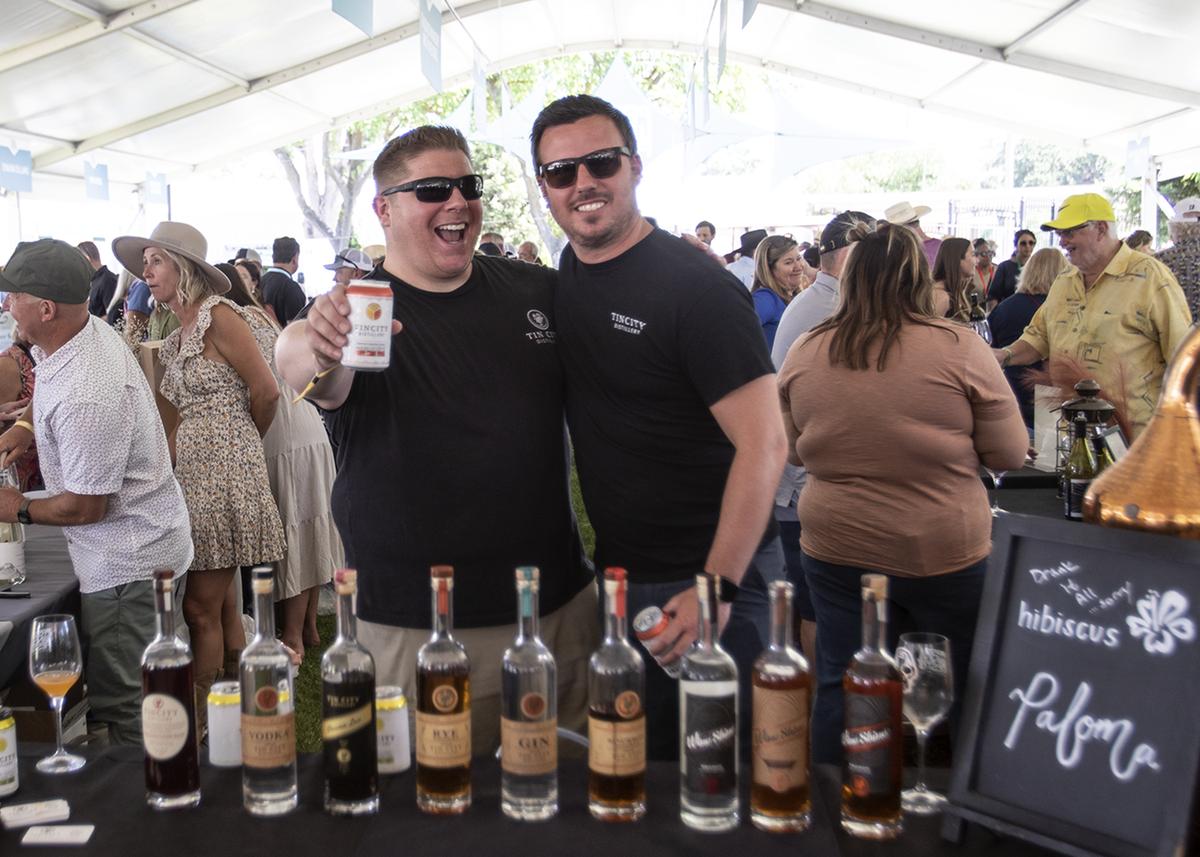 Patrick Brooks and John Lewis from Tin City Distillery have fun at the Paso Wine Fest on Saturday, May 20, 2023. The festival celebrated its 40th year in Paso Robles, featuring the Grand Tasting, winemaker dinners and special events at area wineries.