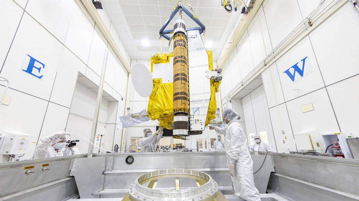 Inside a clean room at Johns Hopkins APL, the DART spacecraft is moved into a specialized shipping container to head across the country to Vandenberg Space Force Base near Lompoc, where DART is scheduled to launch from late next month.