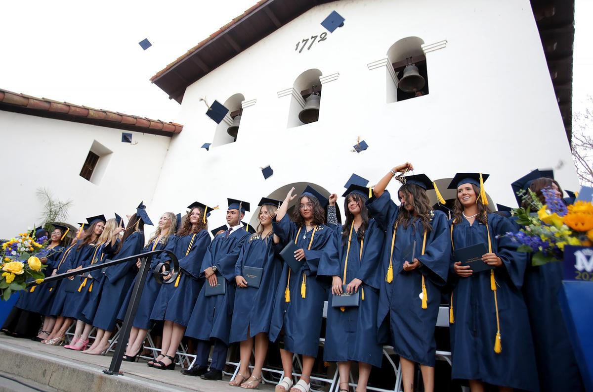 The graduating class of 2025 toss their caps in the air after graduating. Eighty-three Mission Prep students graduated in San Luis Obispo, earning nearly $2 million in scholarships.