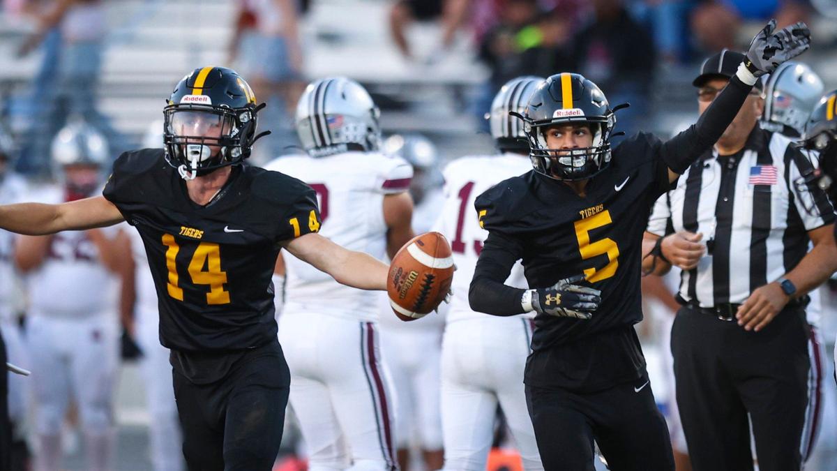 Andrew De La Motte celbrates a fumble recovery and Gabriel Vigil signals first down. Gabriel Vigil San Luis Obispo High School won 34-23 over Mount Whitney, of Visalia Aug. 23, 2024.